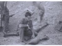 Lt George Montgomery1Lt Montgomery examines a Russian made rocket captured by the 11th ACR at a FSB Burkett Spring 1970.  RMcDonald Photo